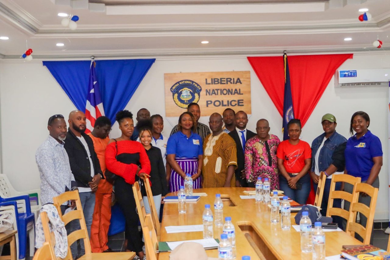 Representatives from Medica Liberia and the Liberia National Police at the signing ceremony